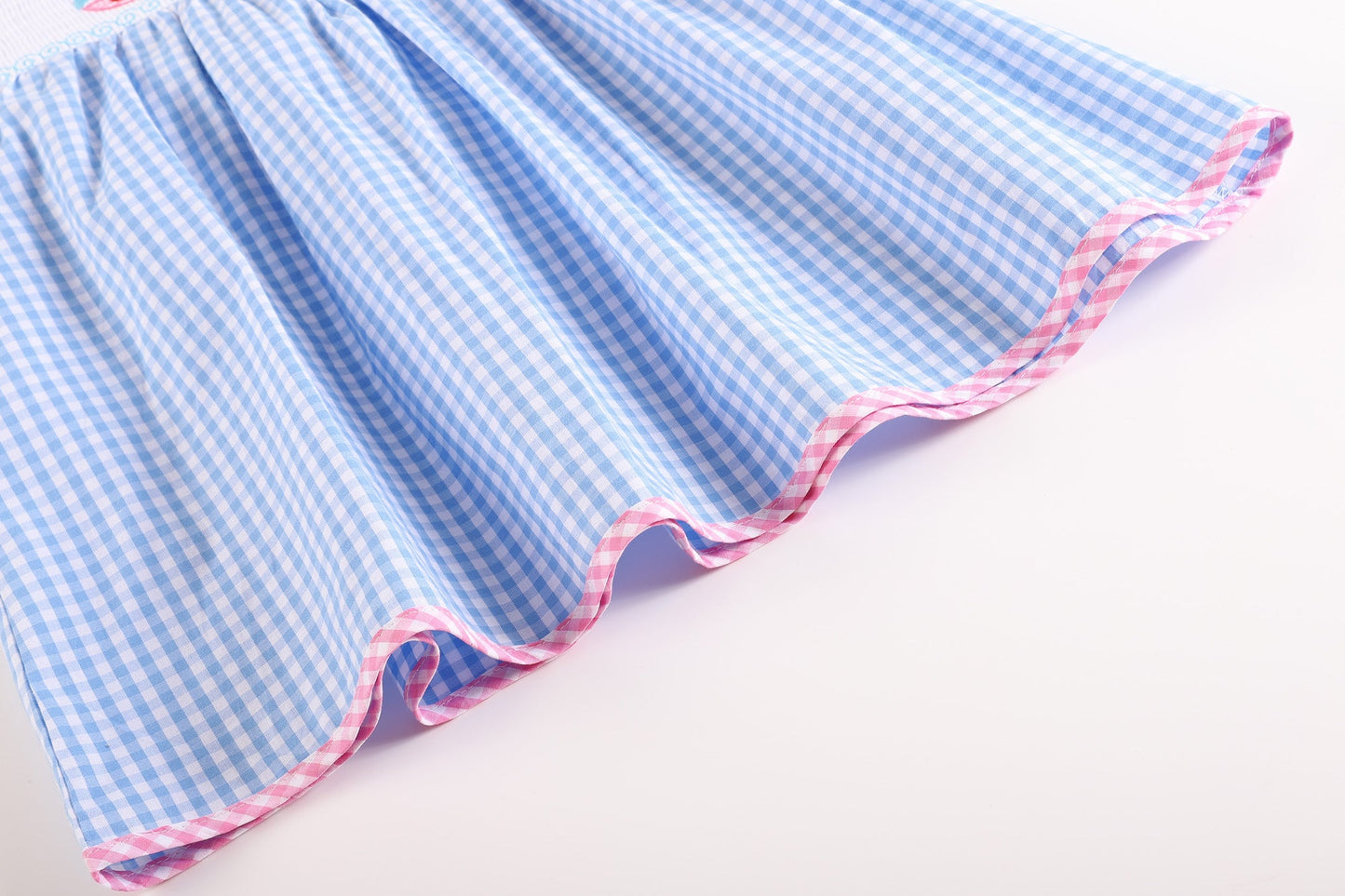 Blue Gingham Sleeveless Smocked Dress with Embroidered Pink Sailboats
