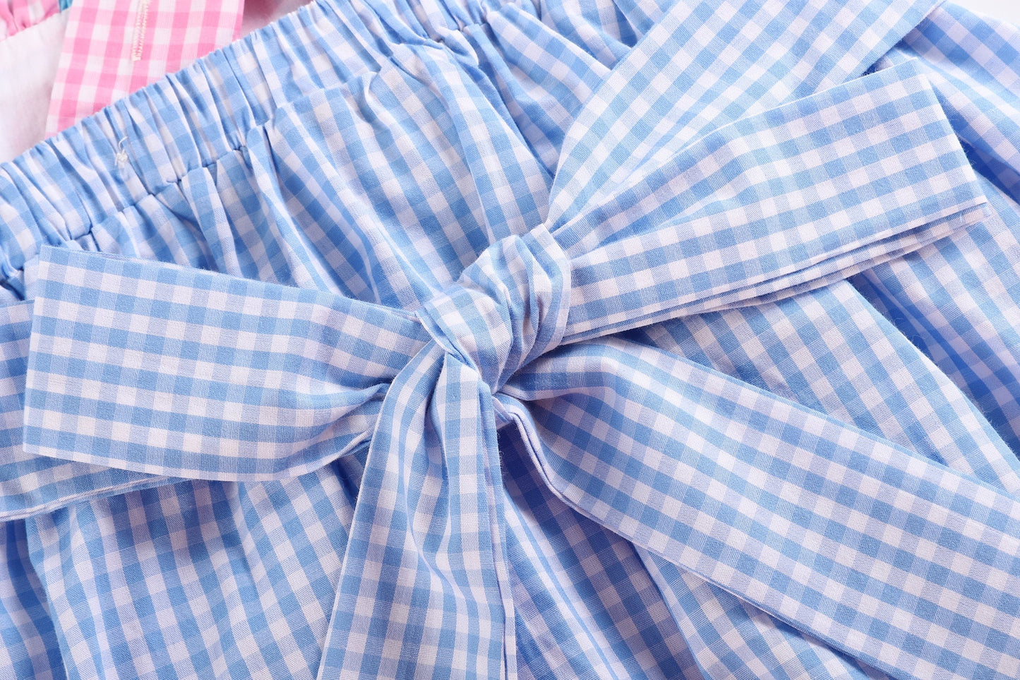 Blue Gingham Sleeveless Smocked Dress with Embroidered Pink Sailboats