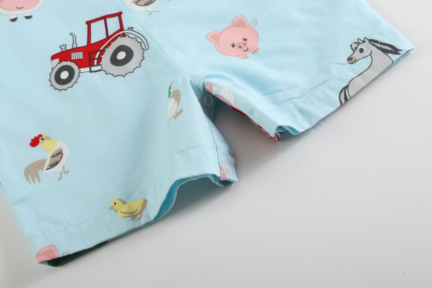 Light Blue Barnyard Print Tractor Smocked Jon Jons
